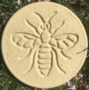 A selection of Bee Decor stepping stones in the colours of buff, charcoal, terracotta and white