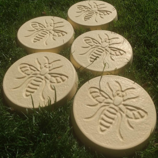 Pack of 5 bee design stepping stones in a buff colour.