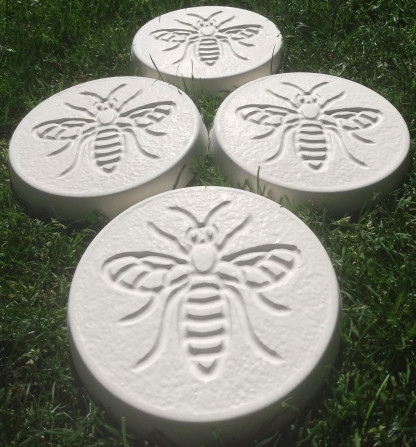 Pack of 4 bee design stepping stones in a white colour.