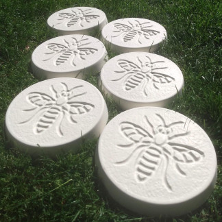 Pack of 6 bee design stepping stones in a white colour.